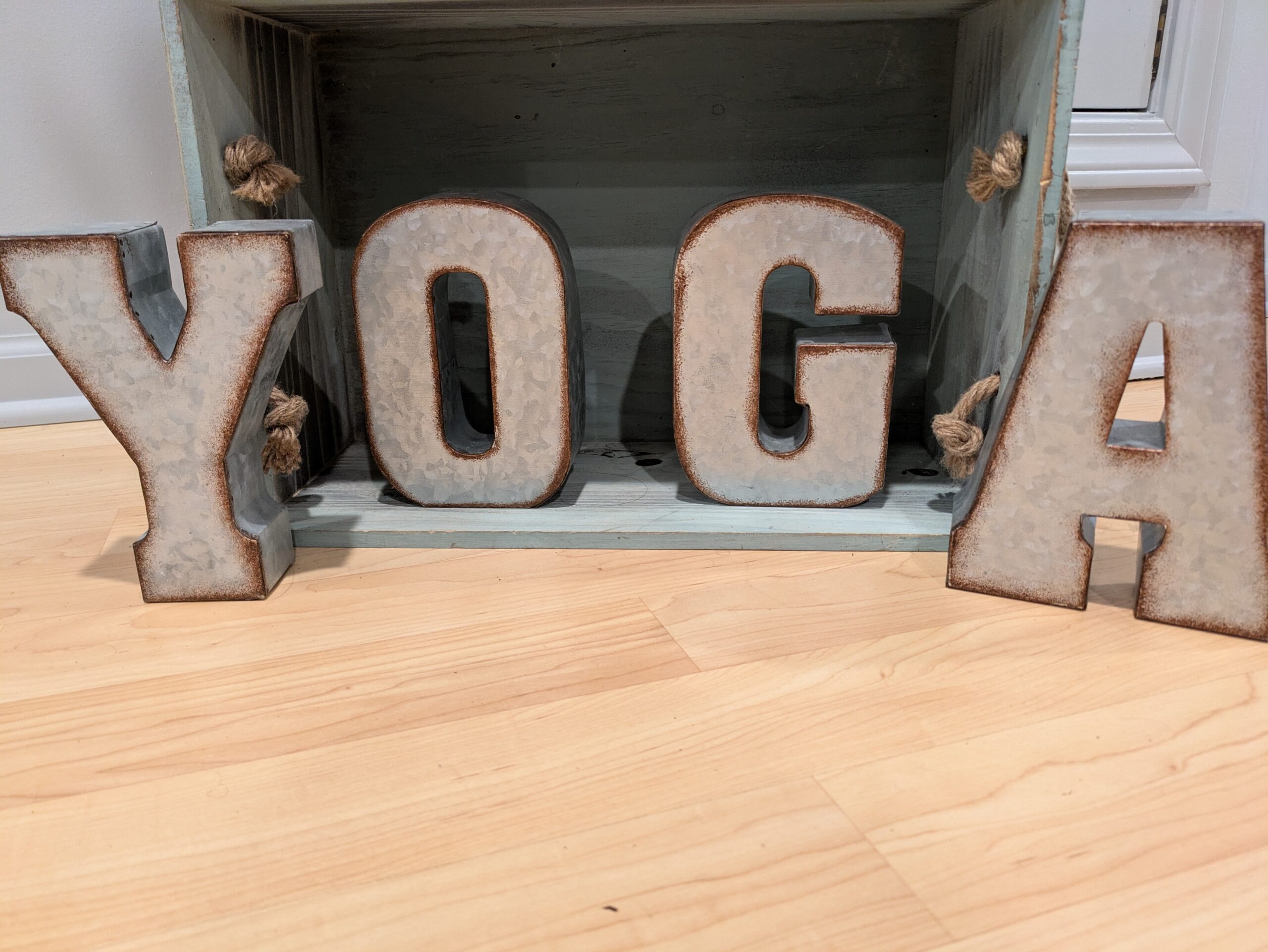 two Jennifer Shelton bands resting on yoga mat